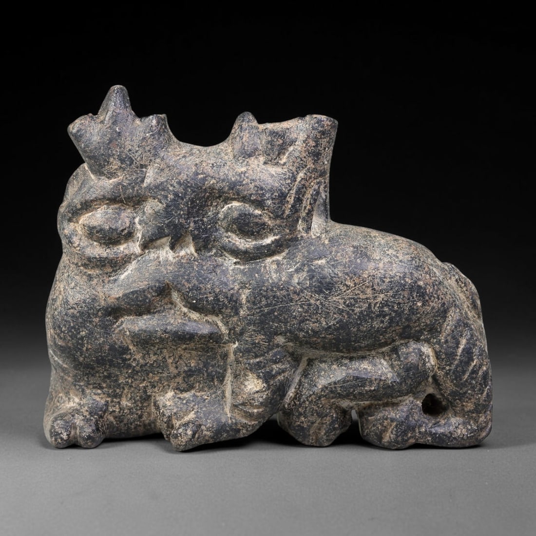 Ancient Sasanian Persian Schist Animal Amulet Plaque (224-651 CE), 24AK: This carved schist amulet plaque originates from the Ancient Sasanian Persian Empire, crafted as a protective talisman object typical of late antiquity West Asian ritual traditions. The dark schist su