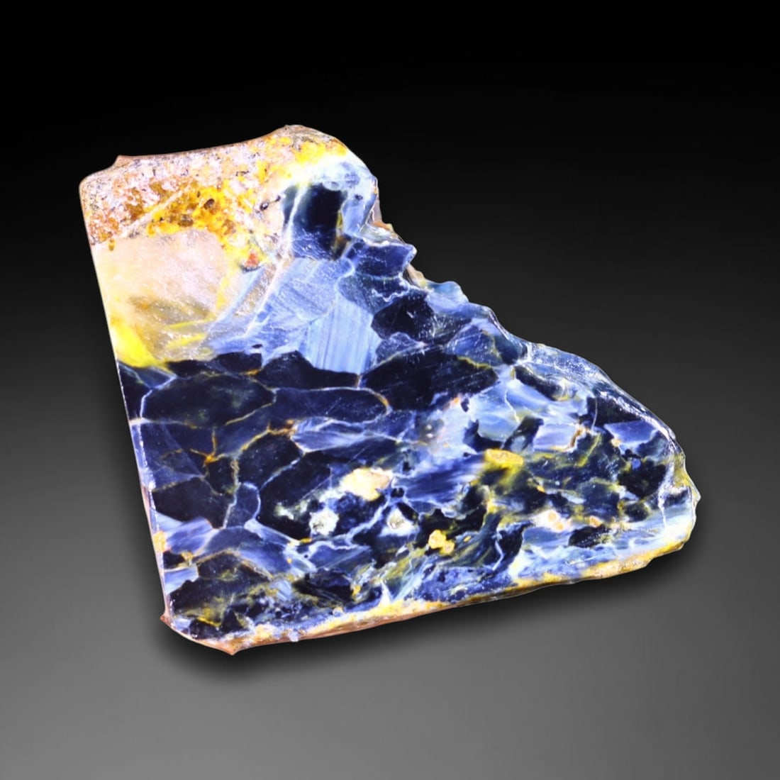 75.75Ct Pietersite Slab - Gemstone Crystal - Freeform Slice, 1073B: No Reserve Gems Auction Subject: Natural Pietersite Origin: Namibia, South Africa Carat Weight: 75.75Ct Dimension: 40.7 x 38.6 x 5.6 mm Treatment: Natural Untreated Shape: Free