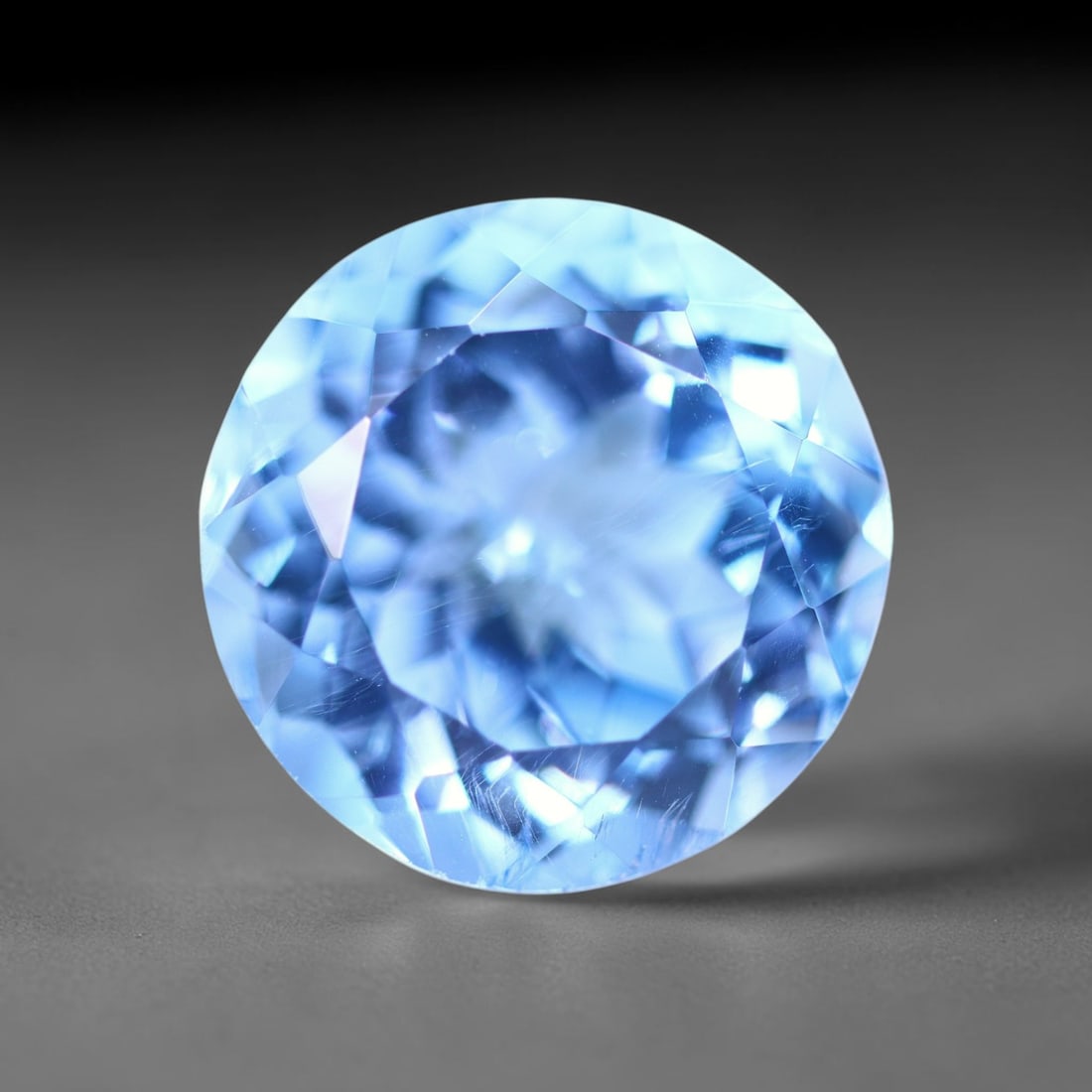 15.26 carats Natural Swiss Blue Topaz - 14.5x14.5x10mm , 842C: No Reserve Gems Auction Subject: Natural Topaz Treatment: Irradiated Type: Faceted, Polished