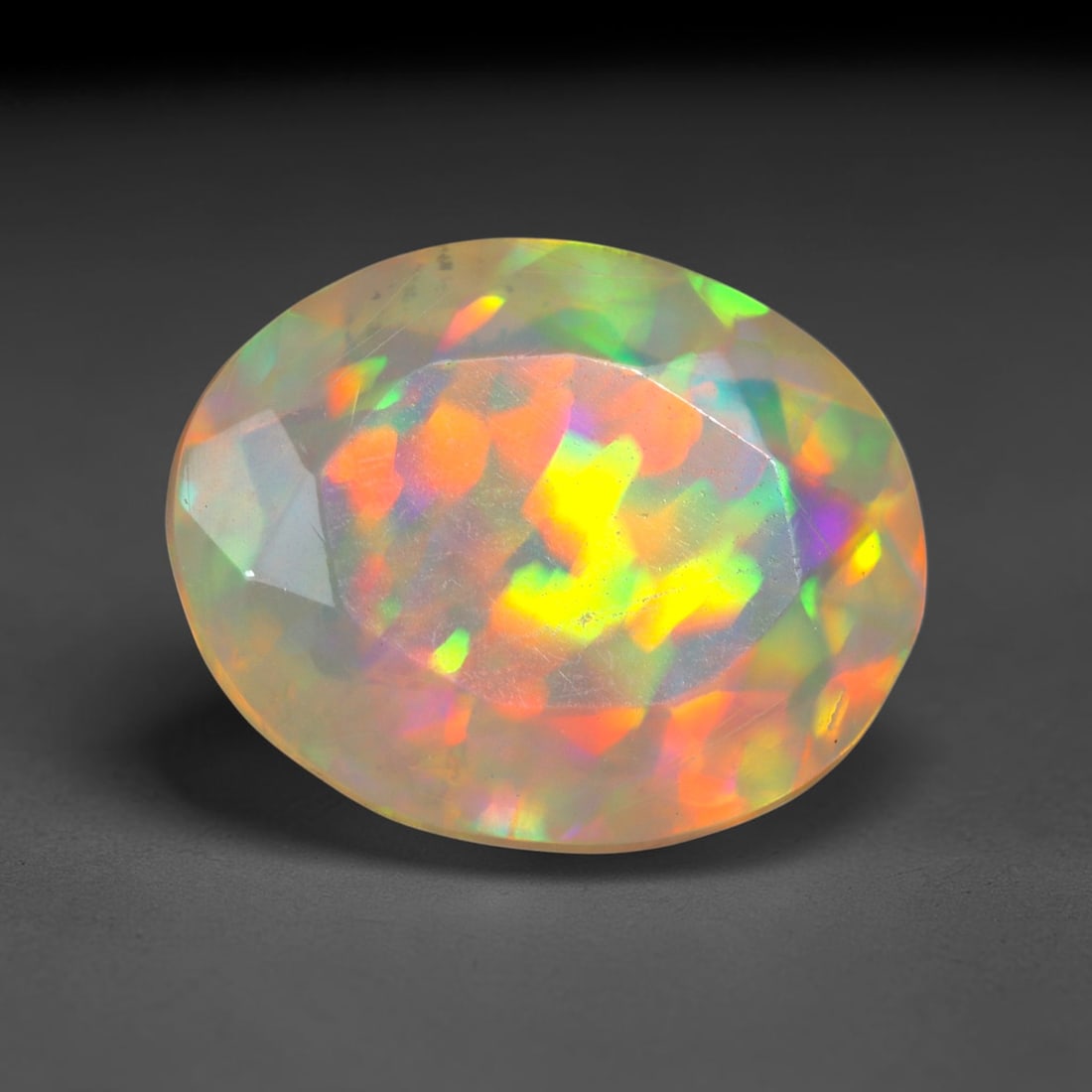 1.50Ct Natural Ethiopian Opal, Faceted Cut - 9.9x8.0x4.4 mm , 678C: No Reserve Gems Auction Subject: Natural Ethiopian Welo Opal Origin: Ethiopia Treatment: Unheated