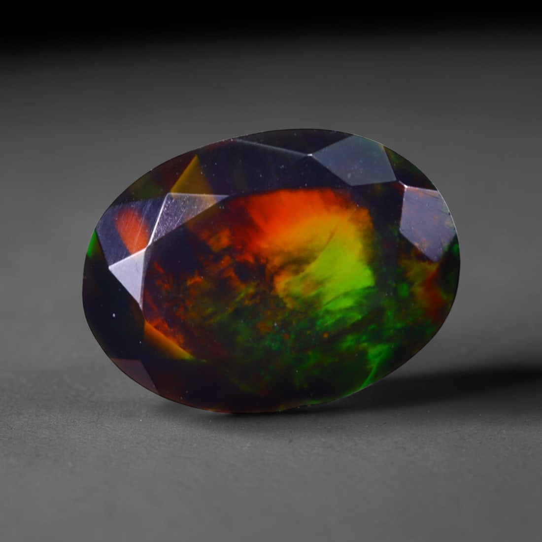 1.40 Ct Black Opal Faceted Cut Polished - Ethiopian Opal - 9x7mm , 927C: No Reserve Gems Auction Subject: Natural Ethiopian Welo Black Opal Origin: Ethiopia Treatment: Smoked