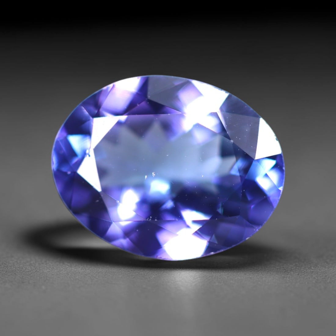 IGI Certified 2.30Ct Tanzanite - Polished Faceted - Oval Faceted , 62E: No Reserve Gems Auction Subject: Natural Tanzanite Origin: Tanzania Carat Weight: 2.30Ct Dimension: 9.9x7.7x4.2mm Treatment: Heated Shape: Oval Type: Faceted, Polished