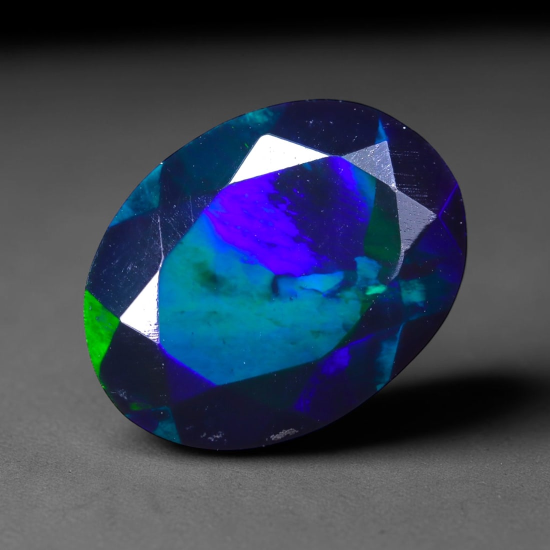 1.86 Ct Black Opal Faceted Cut Polished - Ethiopian Opal - 11x8mm , 911C: No Reserve Gems Auction Subject: Natural Ethiopian Welo Black Opal Origin: Ethiopia Treatment: Smoked