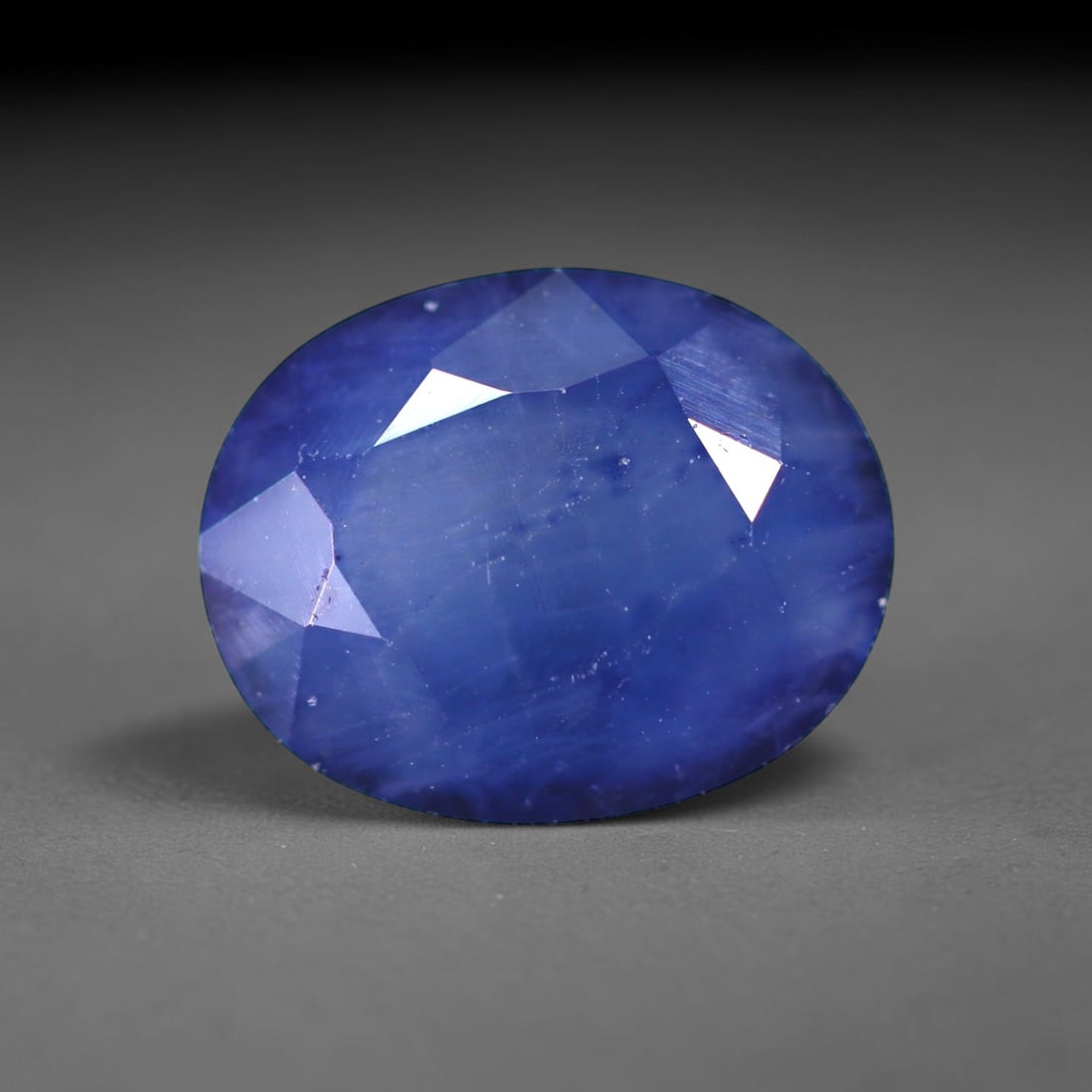 3.59 Ct Blue Sapphire - 10x8x5mm , 981C: No Reserve Gems Auction Subject: Natural Sapphire Treatment: Heated Type: Faceted, Polished