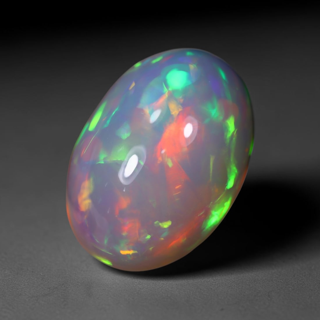 *12.37Ct Welo Opal Polished - Ethiopian Opal , 432C: No Reserve Gems Auction Subject: Natural Ethiopian Welo Opal Origin: Ethiopia Carat Weight: 12.37Ct Dimension: 18.6x13x10.2 mm Treatment: Natural Untreated Type: Cabochon,