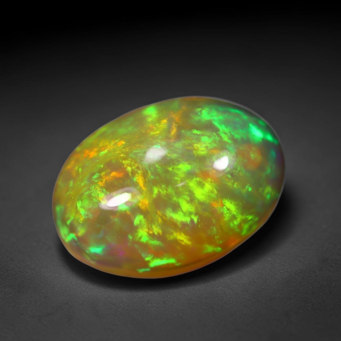 *3.94Ct Welo Opal Polished - Ethiopian Opal , 457C: No Reserve Gems Auction Subject: Natural Ethiopian Welo Opal Origin: Ethiopia Carat Weight: 3.94Ct Dimension: 13.7x9.6x6.2 mm Treatment: Natural Untreated Type: Cabochon, Polished