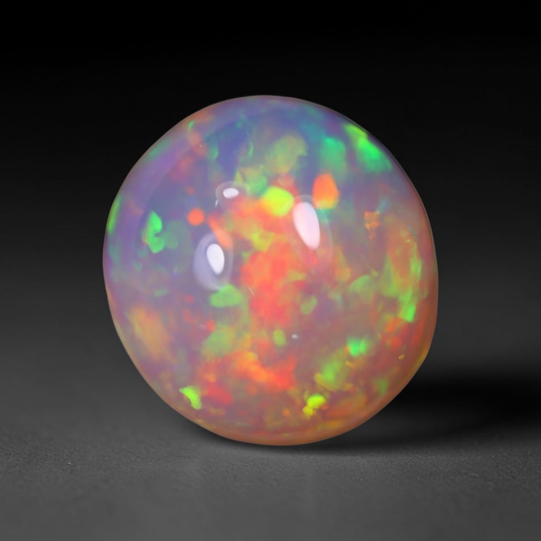*5.97Ct Welo Opal Polished - Ethiopian Opal, 505B: No Reserve Gems Auction Subject: Natural Ethiopian Welo Opal Origin: Ethiopia Carat Weight: 5.97Ct Dimension: 13.1x12.3x7.1 mm Treatment: Natural Untreated Type: Cabochon, Poli