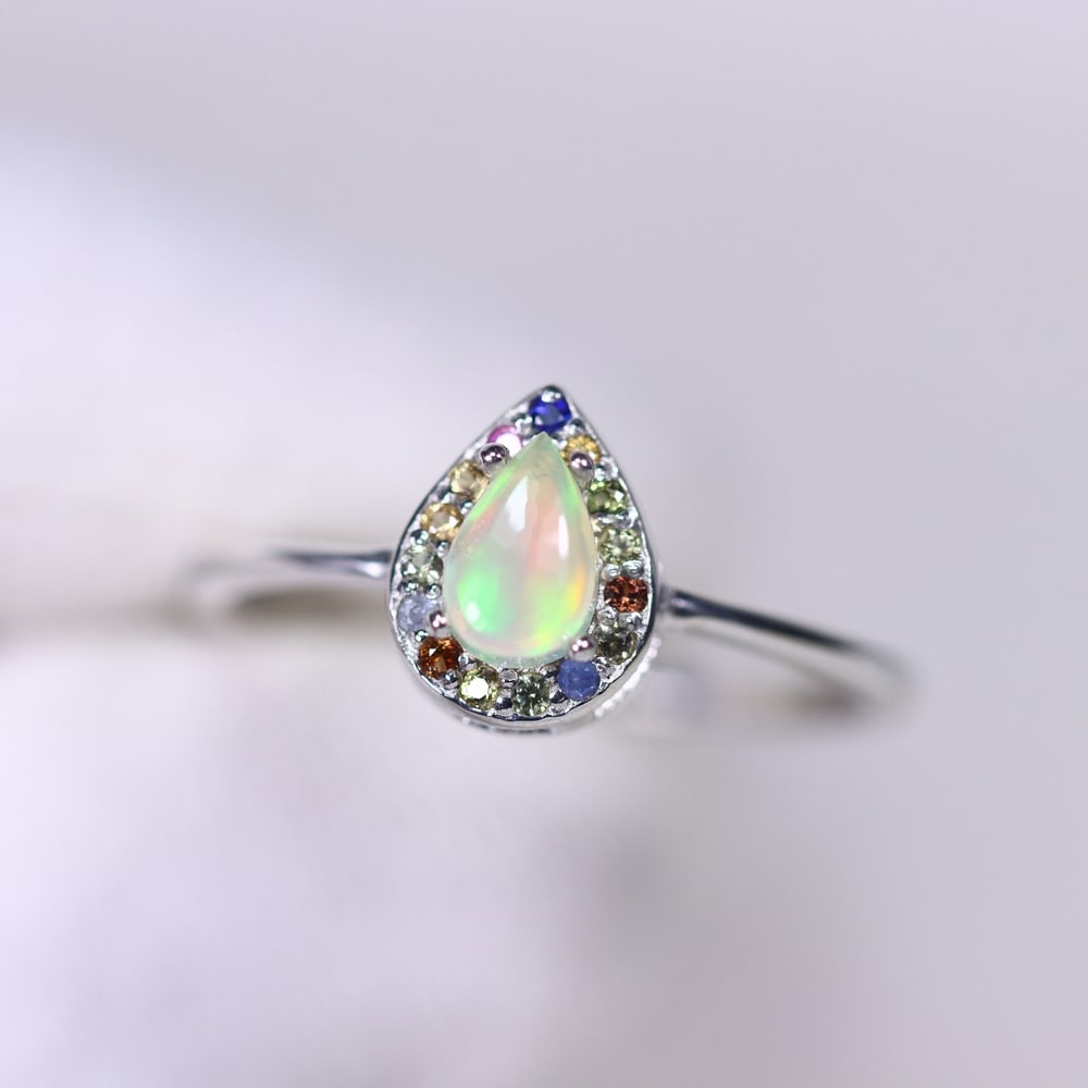 Ring Size US7 Fire Opal & Sapphire - 925 Sterling Silver , 377E: No Reserve Gems Auction Subject: Natural Fire Opal & Sapphire Origin: Thailand Carat Weight: 1.45g Dimension: Gemstone 4x6mm Type: Ring