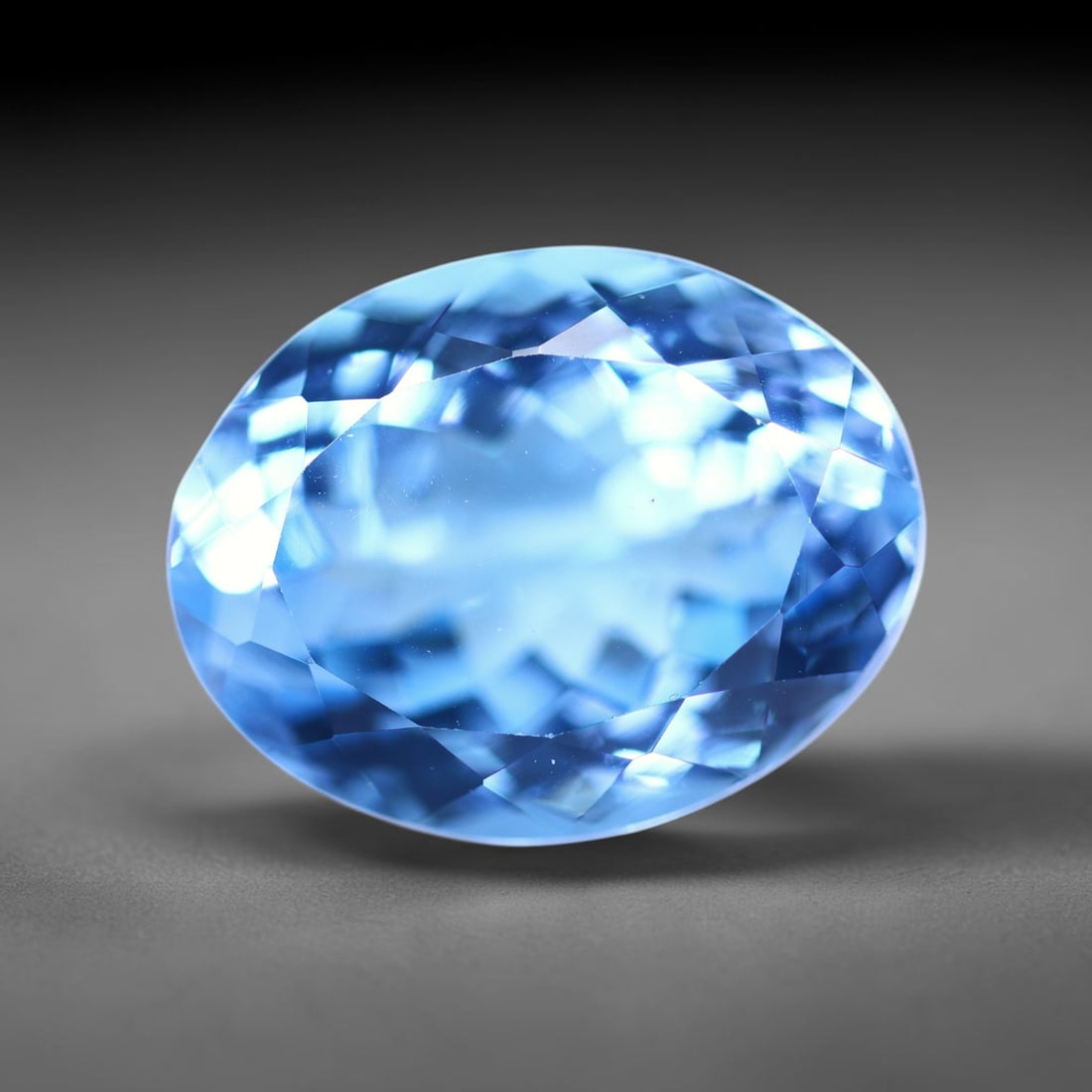 14.43 carats Natural Swiss Blue Topaz - 16.3x12.7x8.8mm , 847C: No Reserve Gems Auction Subject: Natural Topaz Treatment: Irradiated Type: Faceted, Polished