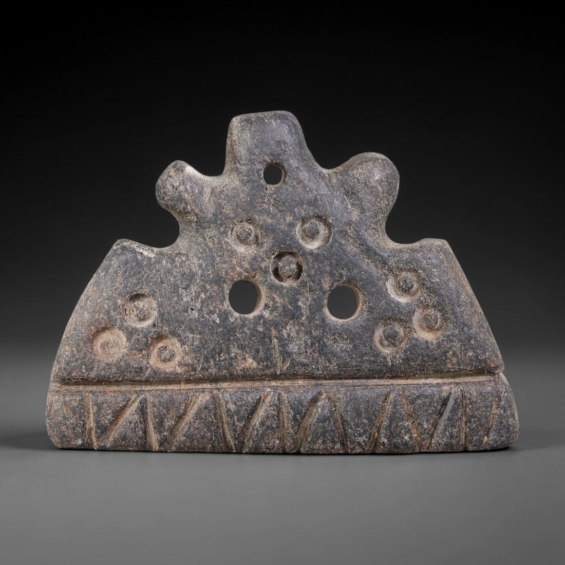Ancient Ubaid-Mesopotamian Pierced Tri-Lobed Stone Pendant Amulet (4500-3500 BCE), 91AJ: This ancient pierced tri-lobed stone pendant amulet originates from Ubaid-Mesopotamian cultural sphere, crafted as a wearable apotropaic ritual ornament. The arched multi-lobed form carries multiple d