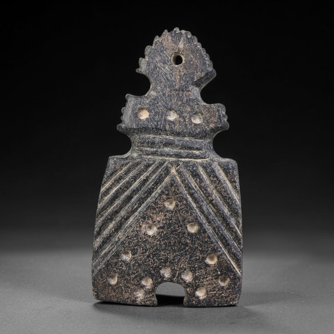 Ancient Umayyad-Abbasid Islamic Mesopotamian Carved Stone Talisman Pendant (661-1258 CE), 23AK: This carved stone talisman pendant originates from Umayyad & Abbasid Islamic Mesopotamian culture, representative of medieval West-Asian apotropaic amulet craft for personal protective wear. The table