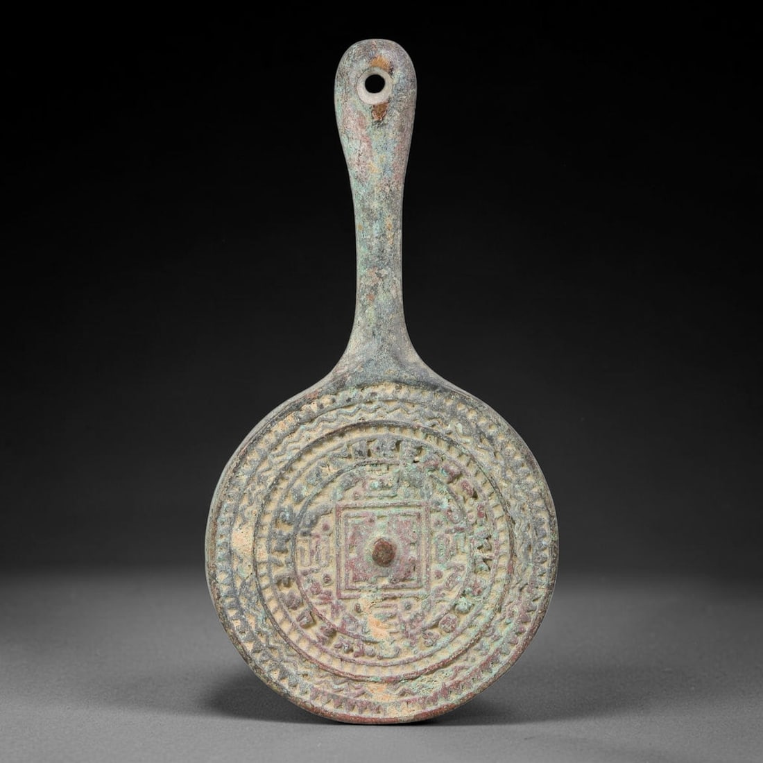 A Chinese Bronze Hand-Held Cosmological TLV-Style Mirror, 61AD (1 of 2)