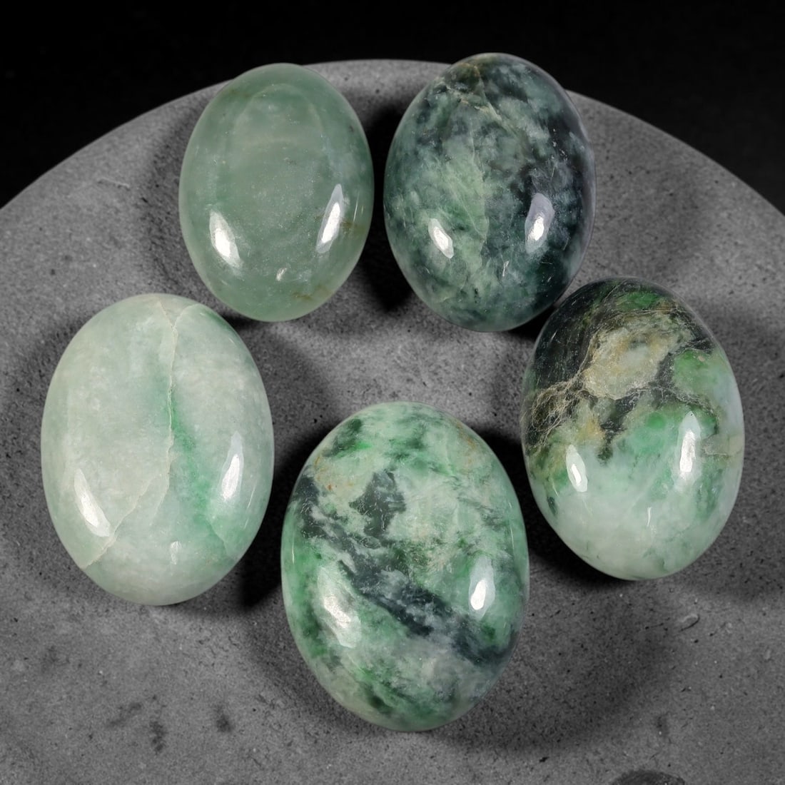 172ct Natural Burmese Type A Jadeite Jade Cabochon Parcel Lot, 58AL: This polished oval cabochon parcel displays natural Type A burmese jadeite jade with broad colour variation. High gloss polished domed surfaces reveal natural internal crystalline textures, mineral ve