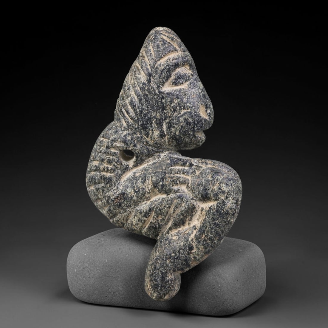 Ancient Sogdian Culture Crouching Anthropomorphic Stone Pendant Amulet (500 BCE-800 CE), 15AK: This ancient crouching anthropomorphic stone pendant amulet originates from Sogdian Culture, produced as a wearable apotropaic talisman among Central Asian Silk-Road communities. The dynamically posed
