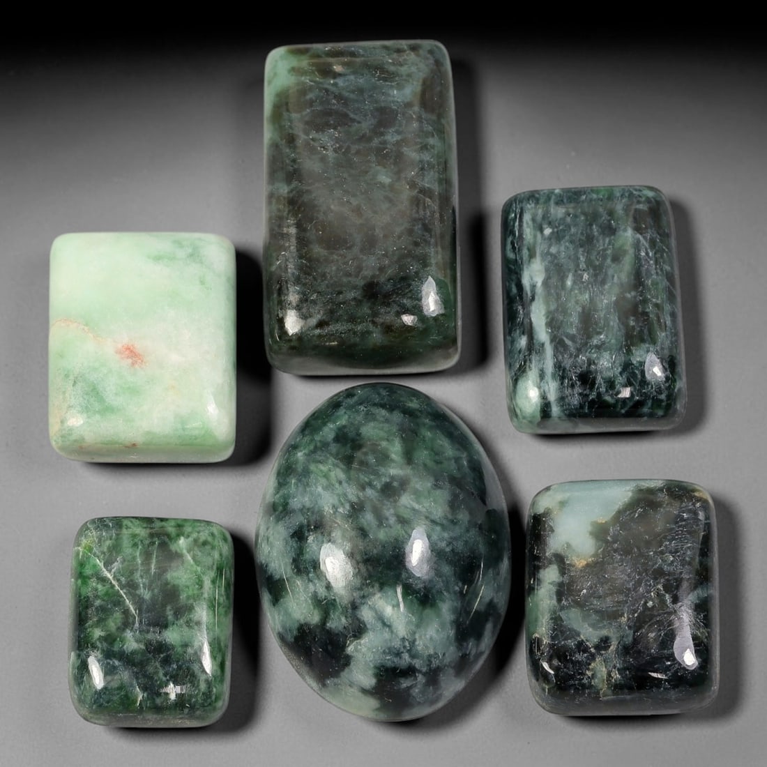 187ct Natural Burmese Type A Jadeite Jade Cabochon Parcel Lot, 52AL: This polished oval cabochon parcel displays natural Type A burmese jadeite jade with broad colour variation. High gloss polished domed surfaces reveal natural internal crystalline textures, mineral ve