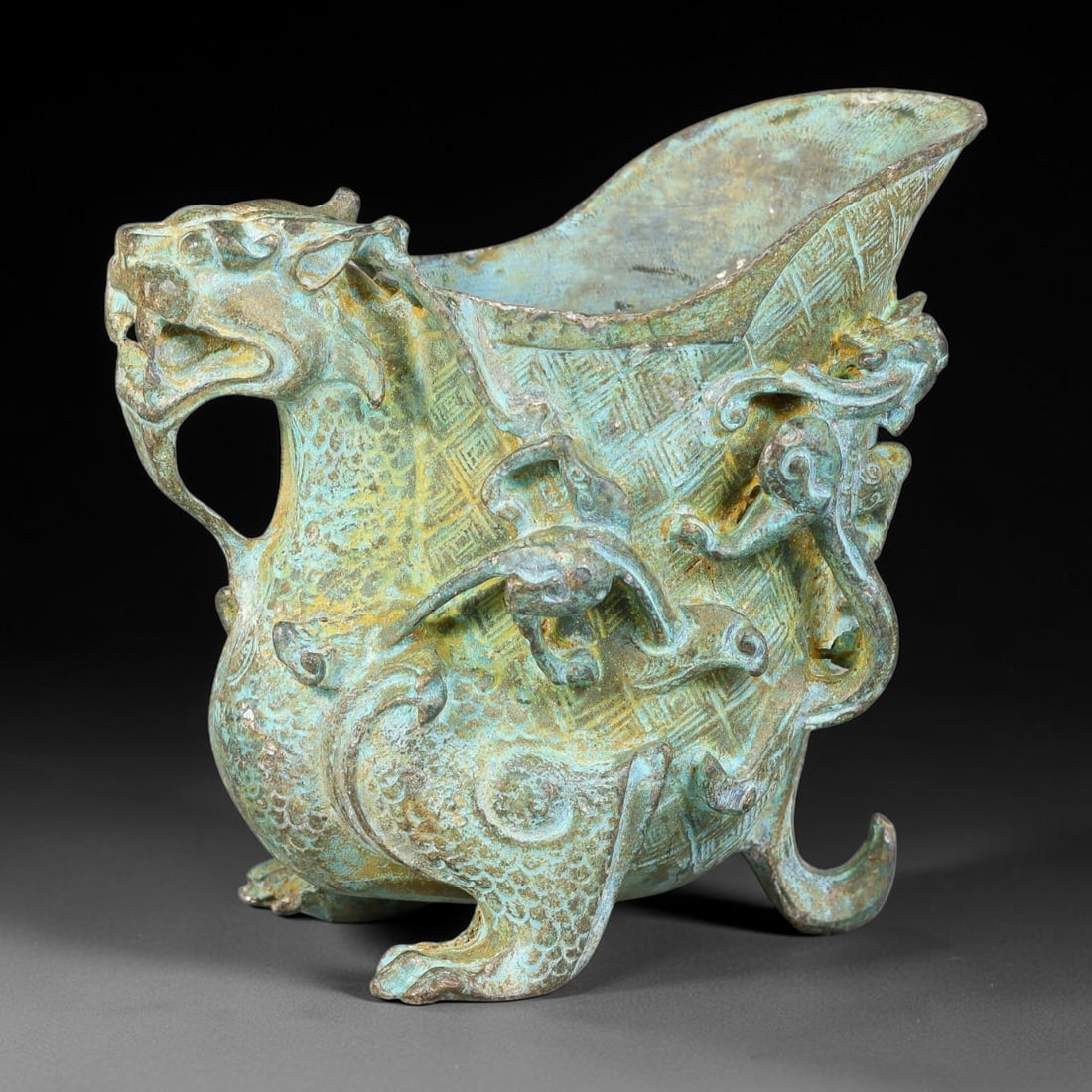 A Chinese Archaic-Style Bronze Mythical Beast Libation Vessel, 10AJ (1 of 3)
