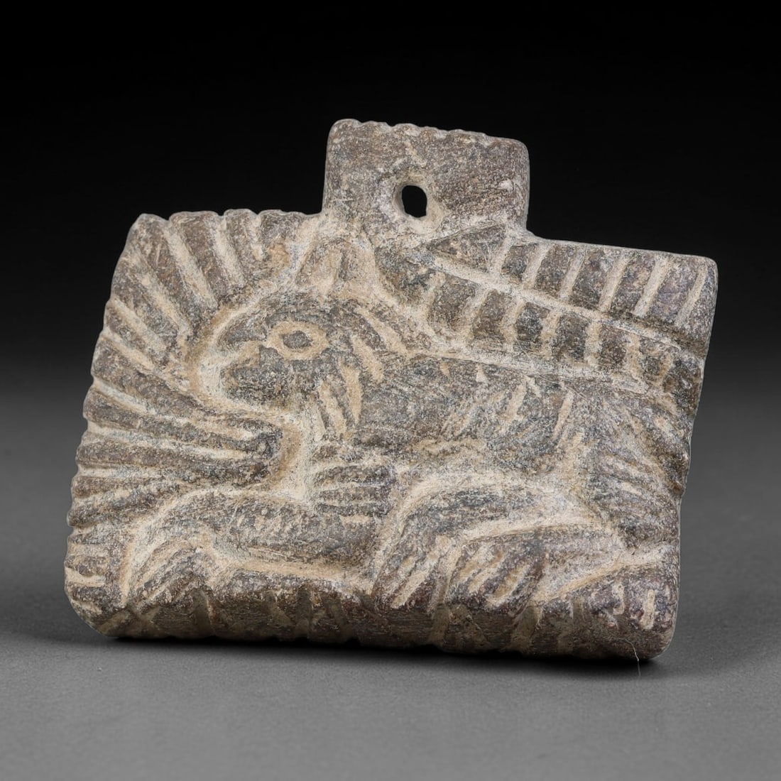 Ancient Sasanian Persian Carved Stone Zoomorphic Pendant Amulet (224-651 CE), 93AJ: This ancient carved stone zoomorphic pendant amulet originates from the Sasanian Persian Empire, manufactured as an apotropaic wearable talisman characteristic of late-antique Persian protective icono