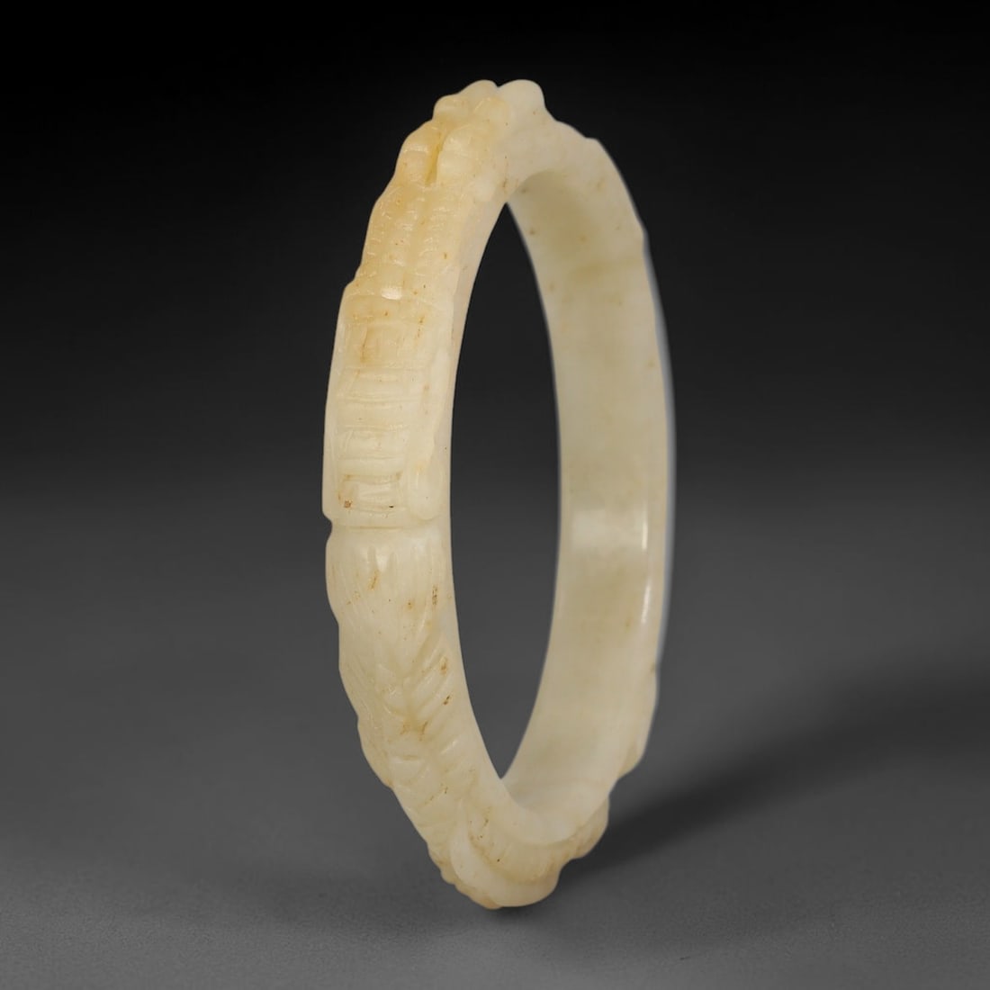 Natural Burmese Type A Jadeite Jade Carving Bangle Bracelet, 66AL: Natural Burmese Type A jadeite jade carved bangle bracelet, inner diameter 58mm, featuring continuous relief decorative carving across the band. This solid bangle displays natural stone inclusions and