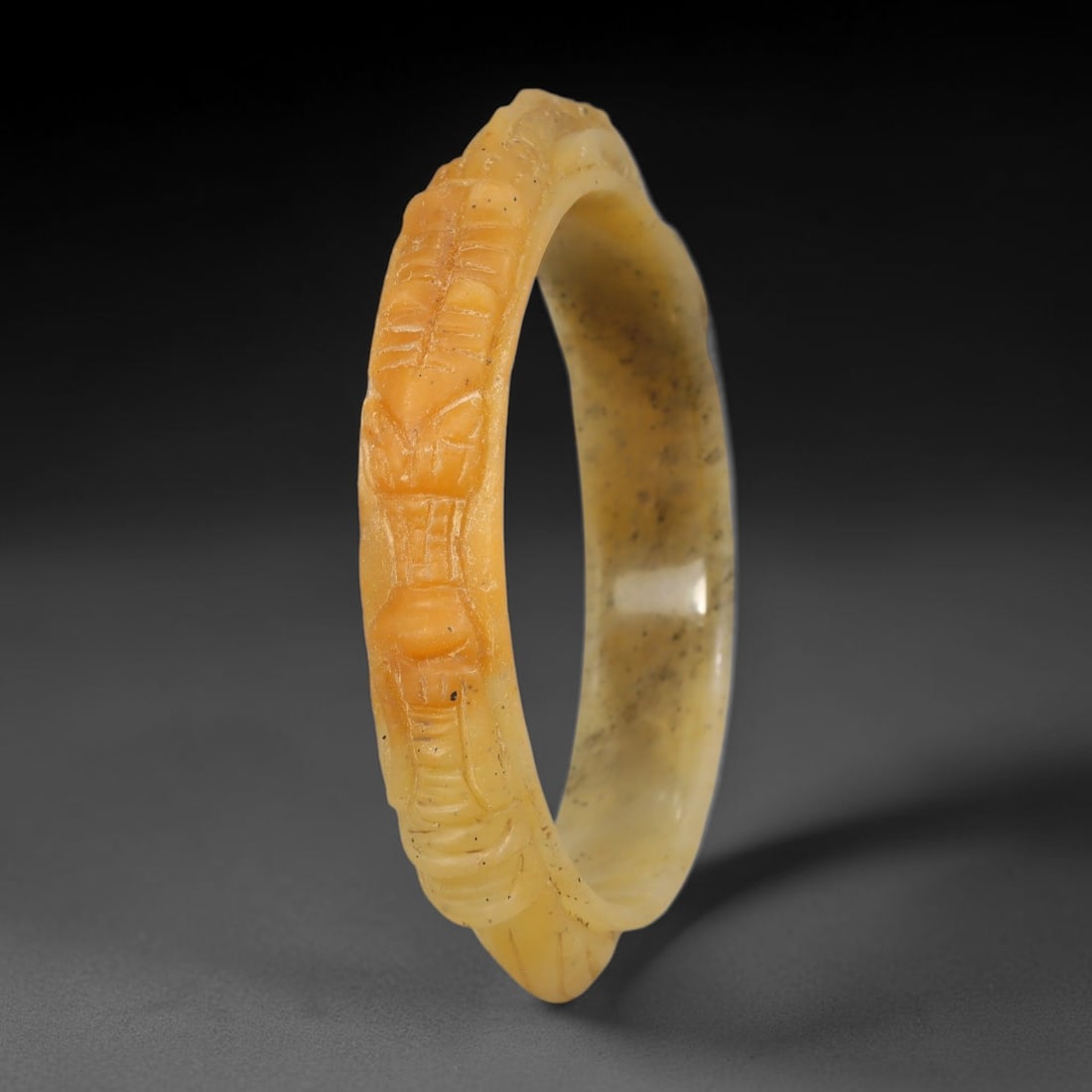 Natural Burmese Type A Jadeite Jade Carving Bangle Bracelet, 71AL: Natural Burmese Type A jadeite jade carved bangle bracelet, inner diameter 62mm, featuring continuous relief decorative carving across the band. This solid bangle displays natural stone inclusions and