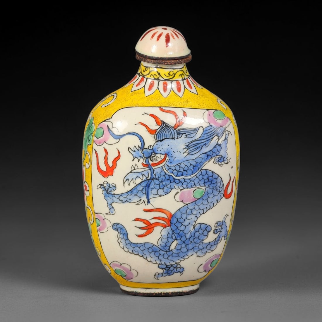 A Chinese Qianlong Marked Bronze Enamel Snuff Bottle, 73AV: Constructed from bronze with painted enamel decoration, the snuff bottle has an ovoid body with a short neck and fitted enamel stopper. The exterior features a bright yellow ground border framing a wh