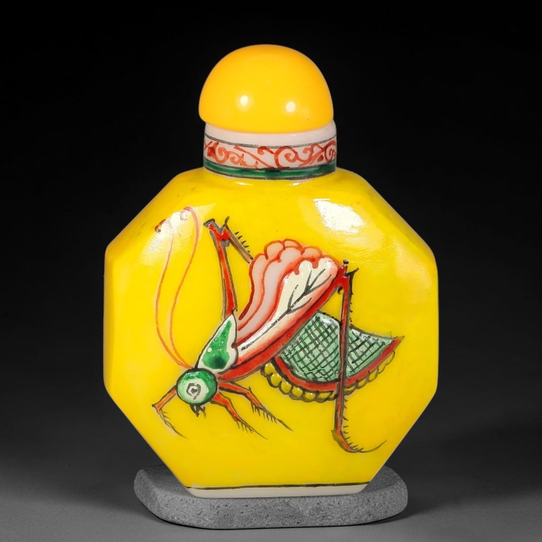 A Chinese Yellow Ground Glass Enamel Painted Cricket Snuff Bottle, 6AV: Octagonal glass snuff bottle with vibrant yellow ground and finely enamel painted cricket motif. The insect is vividly rendered with multi-coloured details, long antennae and segmented limbs. The neck