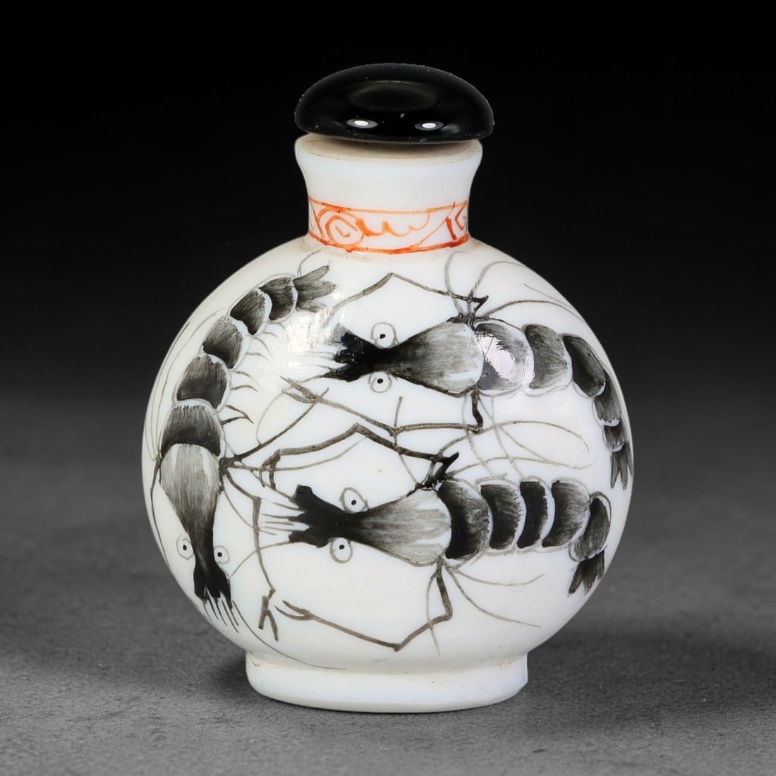 A Chinese White Glass Ink Painted Shrimp Snuff Bottle, 97AL: Globular opaque white glass snuff bottle decorated with fluid ink-painted shrimp motif in black and grey tones, with delicate fine lines depicting antennae and limbs. The neck features a small band of