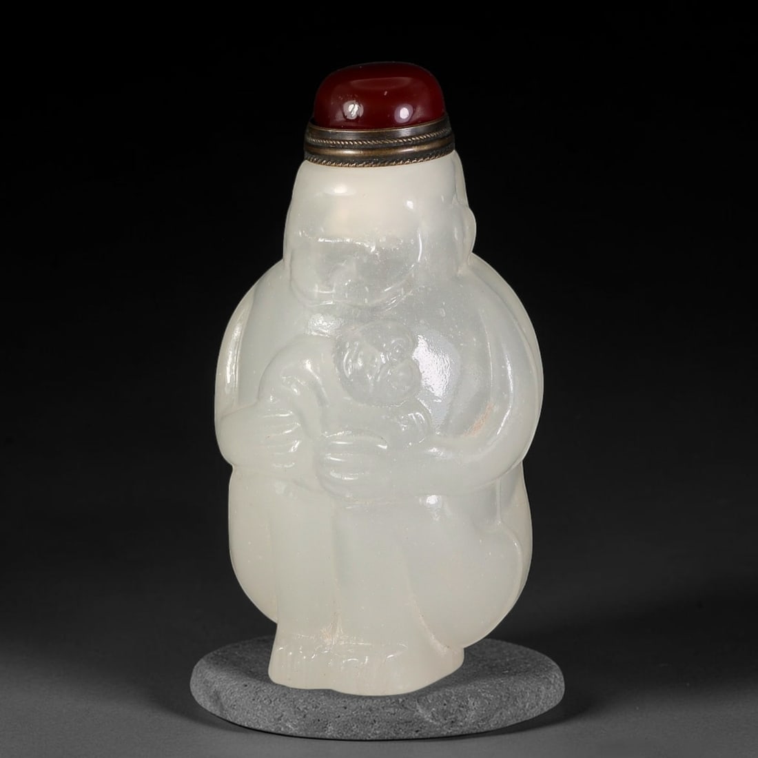 A Chinese Peking Glass Mother and Young Monkey Figural Snuff Bottle, 57AV: Figural snuff bottle carved from pale translucent Peking glass, modelled as a seated mother monkey cradling her young, with smooth rounded forms and subtle facial detailing. The vessel is fitted with 