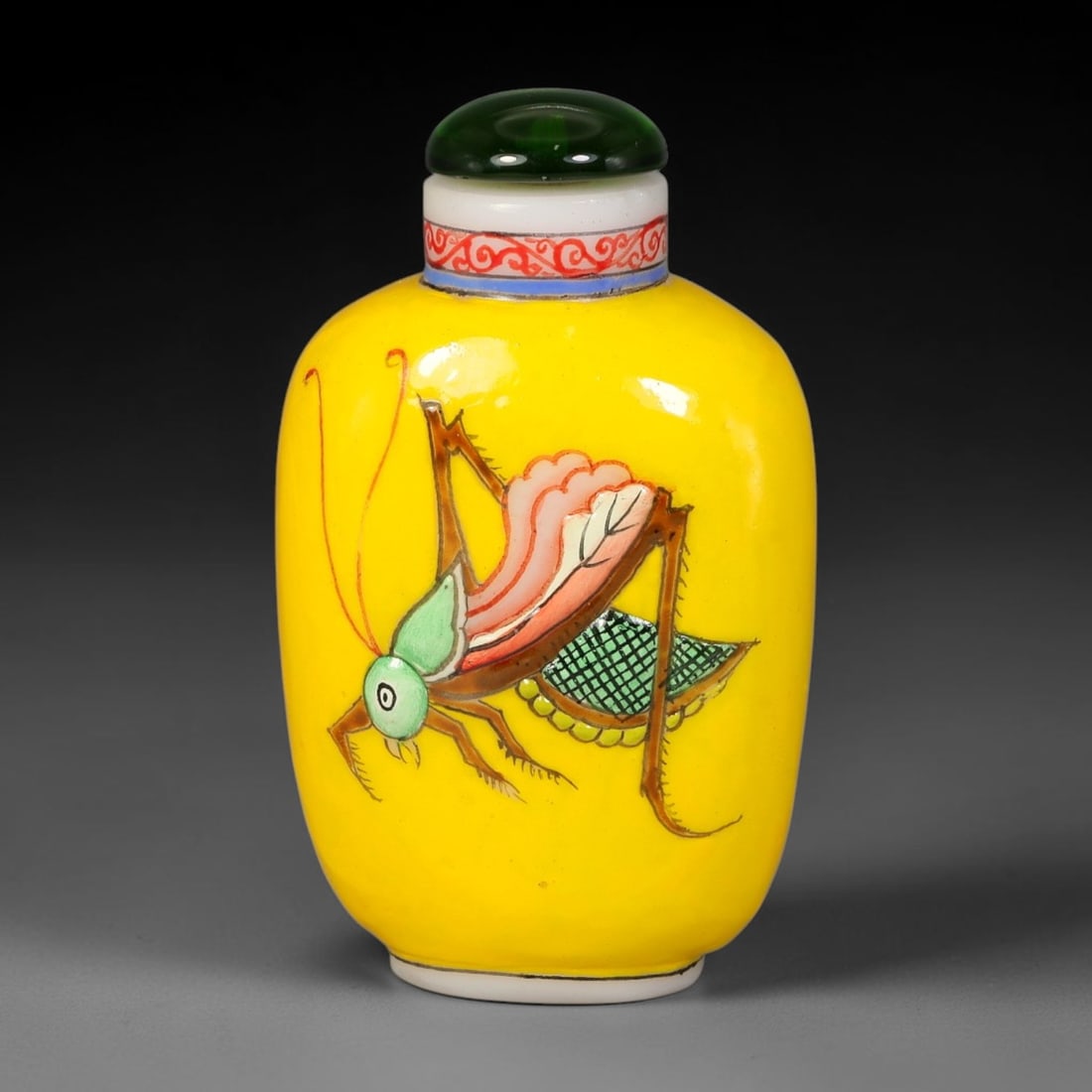 A Chinese Yellow Glass Enamel Cricket Snuff Bottle, 88AL: Ovoid yellow glass snuff bottle finely decorated with a vividly painted cricket motif, rendered in multi-coloured enamel with fine detail on antennae, limbs and wing texture. The neck is adorned with 
