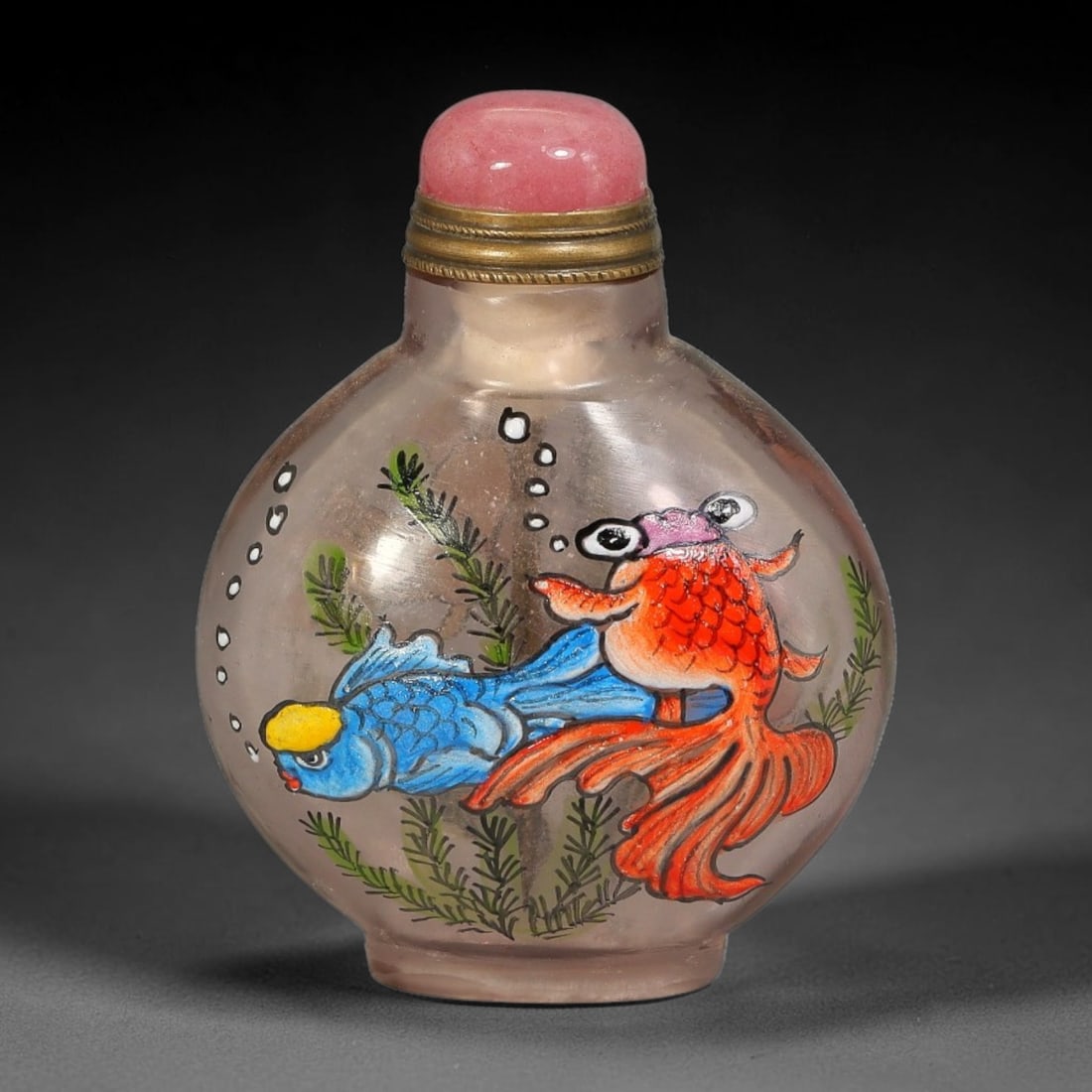 A Chinese Clear Glass Enamel Goldfish Snuff Bottle, 47AV: Globular clear glass snuff bottle decorated with polychrome enamel depicting two goldfish swimming among aquatic foliage and rising air bubbles. The neck is fitted with ribbed brass mounting and a smo
