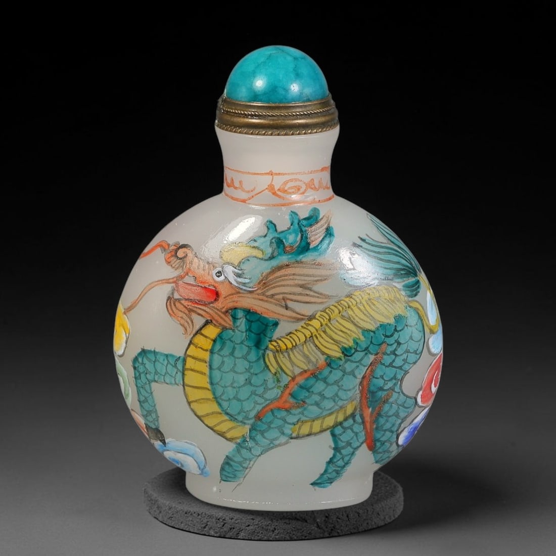 A Chinese White Glass Enamel Painted Qilin Snuff Bottle, 9AV: Globular white glass snuff bottle decorated with hand-painted enamel qilin and cloud motifs on each side. One qilin rendered in teal and yellow scales, the reverse in rich red, both surrounded by colo
