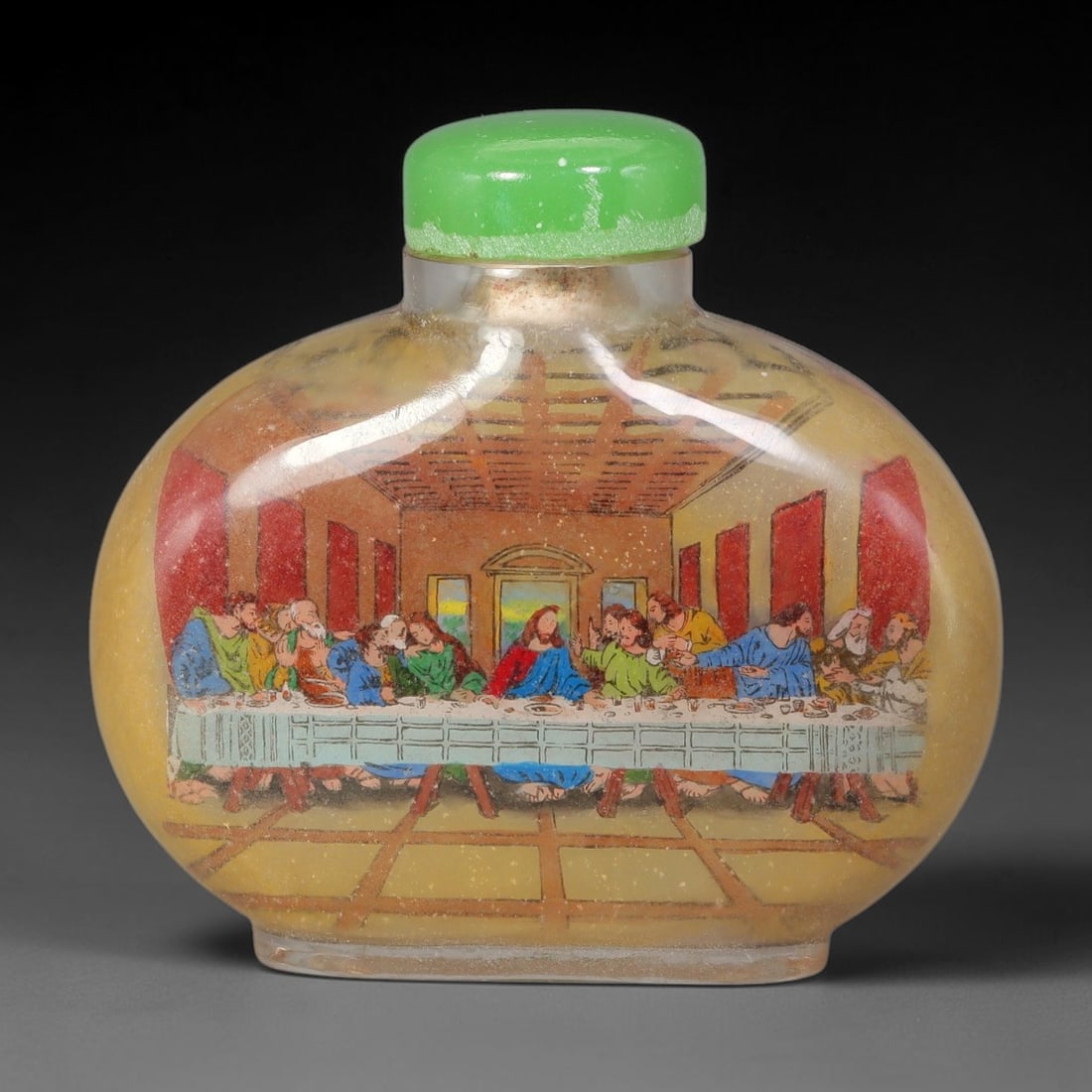 A Chinese Inside Painted The Last Supper Glass Snuff Bottle, 78AV: Flattened globular glass snuff bottle with warm translucent yellow ground, finely decorated with interior painting depicting The Last Supper scene after the famous Renaissance painting, showing the fu