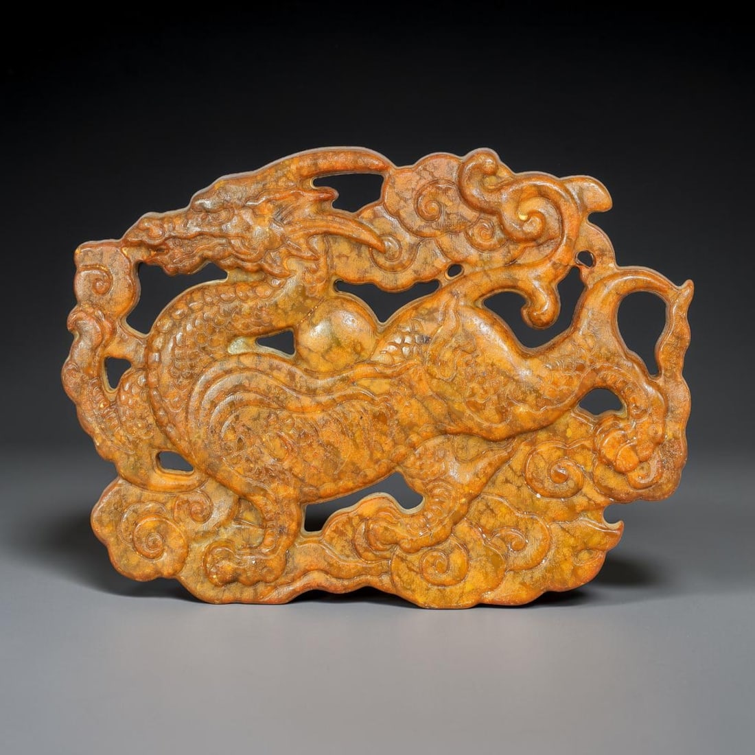 A Chinese Openwork Russet Jade Dragon amid Clouds Plaque, 1BD (1 of 2)