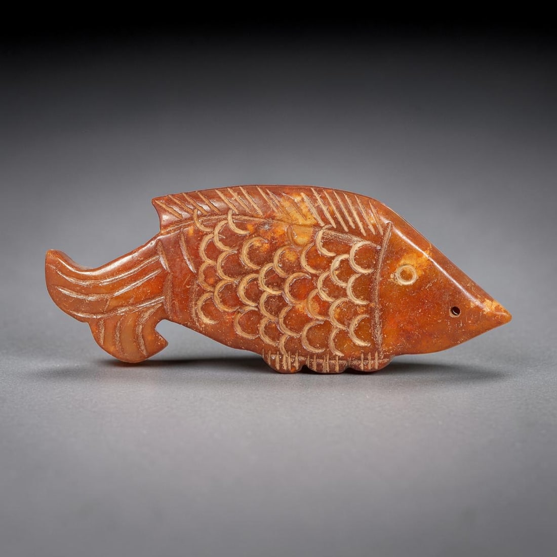 A Chinese Carved Reddish-Brown Jade Fish Pendant, 35BD (1 of 2)