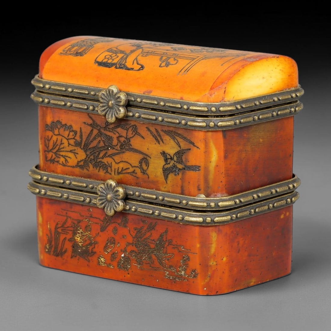 A Chinese Antique Two-Tier Engraved Bone Trinket Box with Figural and Floral Scenes, 53BT: This two-tiered rectangular bone trinket box features a domed top and ornate metal fittings with flower-shaped clasps and beaded edging. The surface is decorated with finely engraved scenes, including