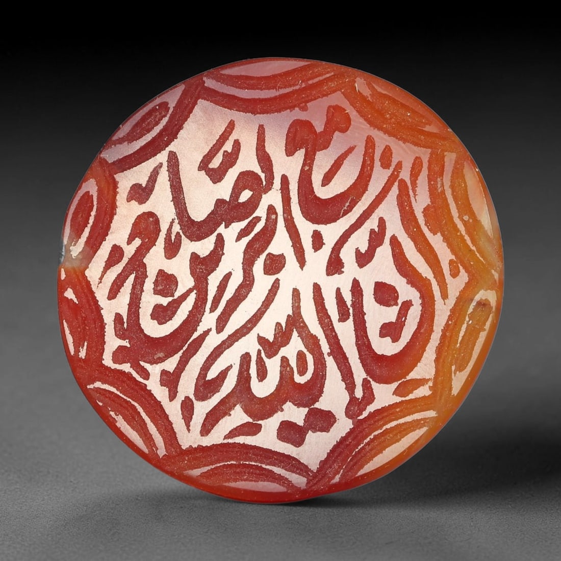 Antique Mughal Style Carnelian Islamic Calligraphic Script Talisman Plaque, 49BQ: This talisman plaque is crafted from carnelian, deeply engraved with flowing Islamic calligraphic script across its face, enclosed within a fine engraved border. The meticulous carving captures elegan