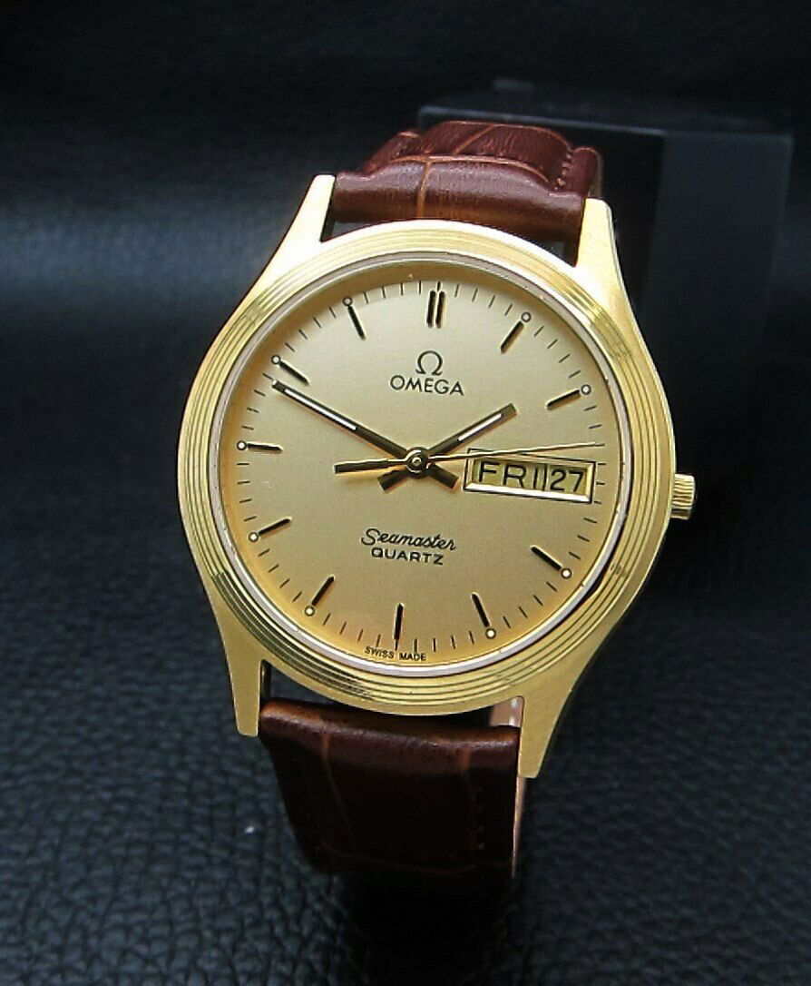 OMEGA SEAMASTER ROSE GOLD DIAL DAY DATE CAL 1425 SWISS: Condition - Fully Working Condition - Ticking Very Well Brand : OMEGASeries : SeamasterMovement : Quartz Cal.1425 OmegaCase Material : Stainless Steel Diameter with Crown : 37 mmCase Thickness : 10 mm