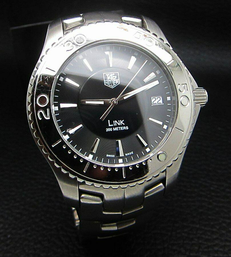 TAG HEUER LINK WJ1110 BLACK QUARTZ SPORTS WATCH: Condition : Good Condition - Brand : Tag HeuerSeries : Link Version - WJ1110Movement : Tag Heuer Quartz Swiss MovementCase Material : Stainless SteelDiameter with Crown : 43 mm BIG CASEDial Color : Bl