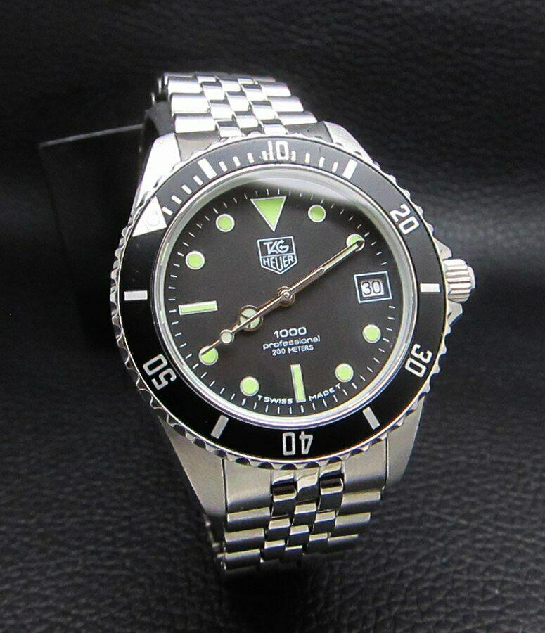 TAG HEUER 1000 Professional Black 200M DIVER WATCH: Tag Heuer 1000, also known as the two tone Wolf of Wall Street. Leonardo DiCaprio wore a all gold Tag Heuer 1000 in the movie Wolf of Wall Street. Condition : Good Condition - Few age related marks co