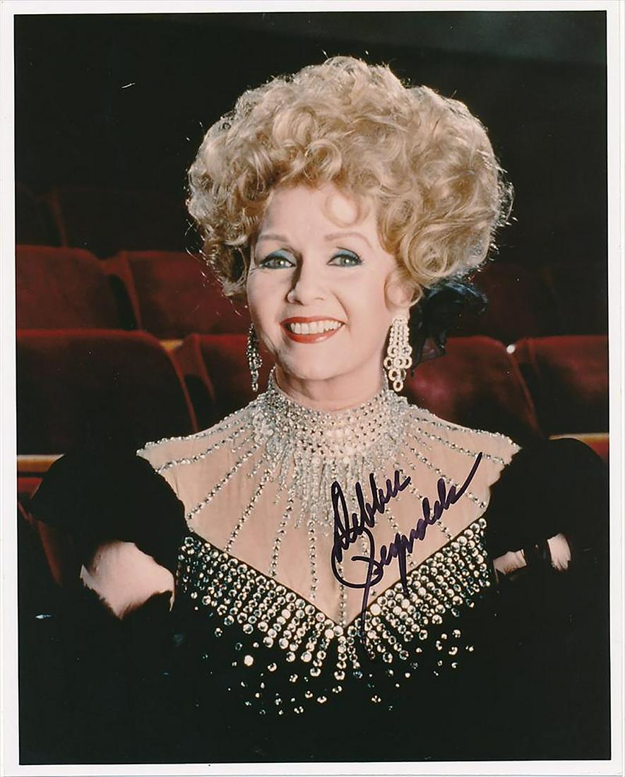 Debbie Reynolds - 8 x 10 Signed Photograph w/COA: Debbie Reynolds - 8 x 10 Signed Photograph w/COA. A signed color glossy photograph of Debbie Reynolds. Signed by her in black felt tip ink. Comes with COA from Todd Mueller Photographs