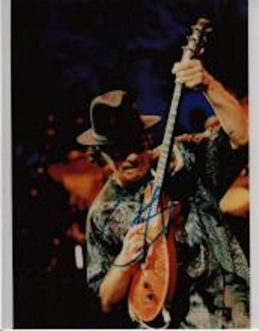 CARLOS SANTANA AUTHENTIC SIGNED 8 X 10 PHOTOGRAPH: CARLOS SANTANA AUTHENTIC SIGNED 8 X 10 PHOTOGRAPH. THIS ITEM HAS BEEN INSPECTED AND AUTHENTICALLY VERIFIED BY ENCORE AUTOGRAPHS. IT IS NOT A COPY, REPRINT, OR ANY KIND OF FACSIMILE OF THE ARTIST'S AUT
