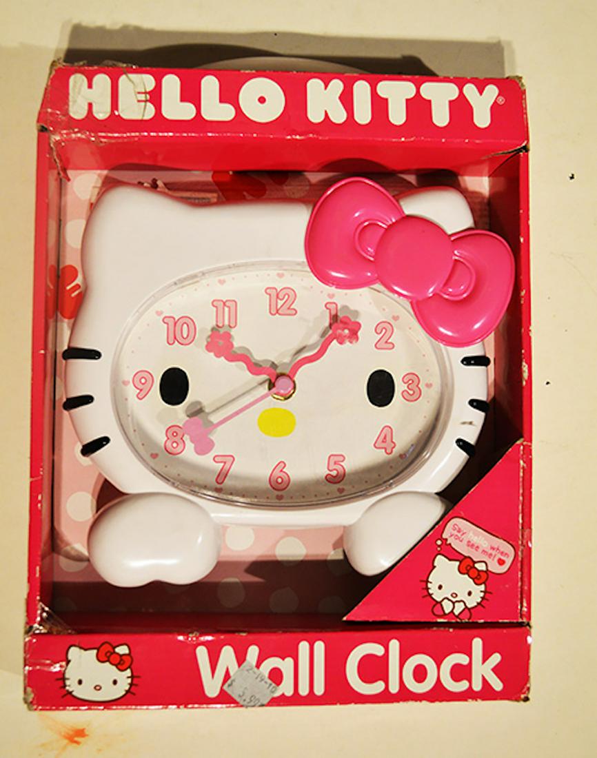 HELLO KITTY WALL CLOCK: HELLO KITTY WALL CLOCK. MEASURES AT 8 INCHES. NEVER USED