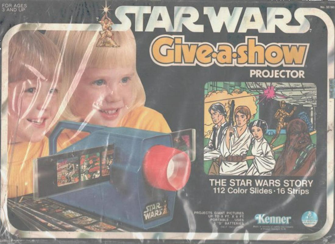 Star Wars "GIVE-A-SHOW" PROJECTOR: Star Wars "GIVE-A-SHOW" PROJECTOR. THE STAR WARS STORY IN 112 COLOR SLIDES (16 STRIPS). PROJECTS GIAN PICTURES UP TO 8 FT. X 8 FT. THIS ITEM IS BATTERY OPERATED. THE BOX SHOWS SOME WEAR AND AGED.
