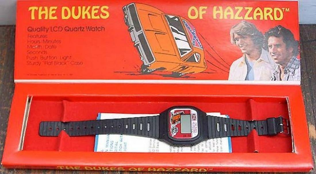 THE DUKES OF HAZZARD "GENERAL LEE" LCD QUARTZ WATCH: THE DUKES OF HAZZARD "GENERAL LEE" LCD QUARTZ WATCH. 1981, FROM WARNER BROTHERS.MINT IN BOX. COMPLETE AND INTACT