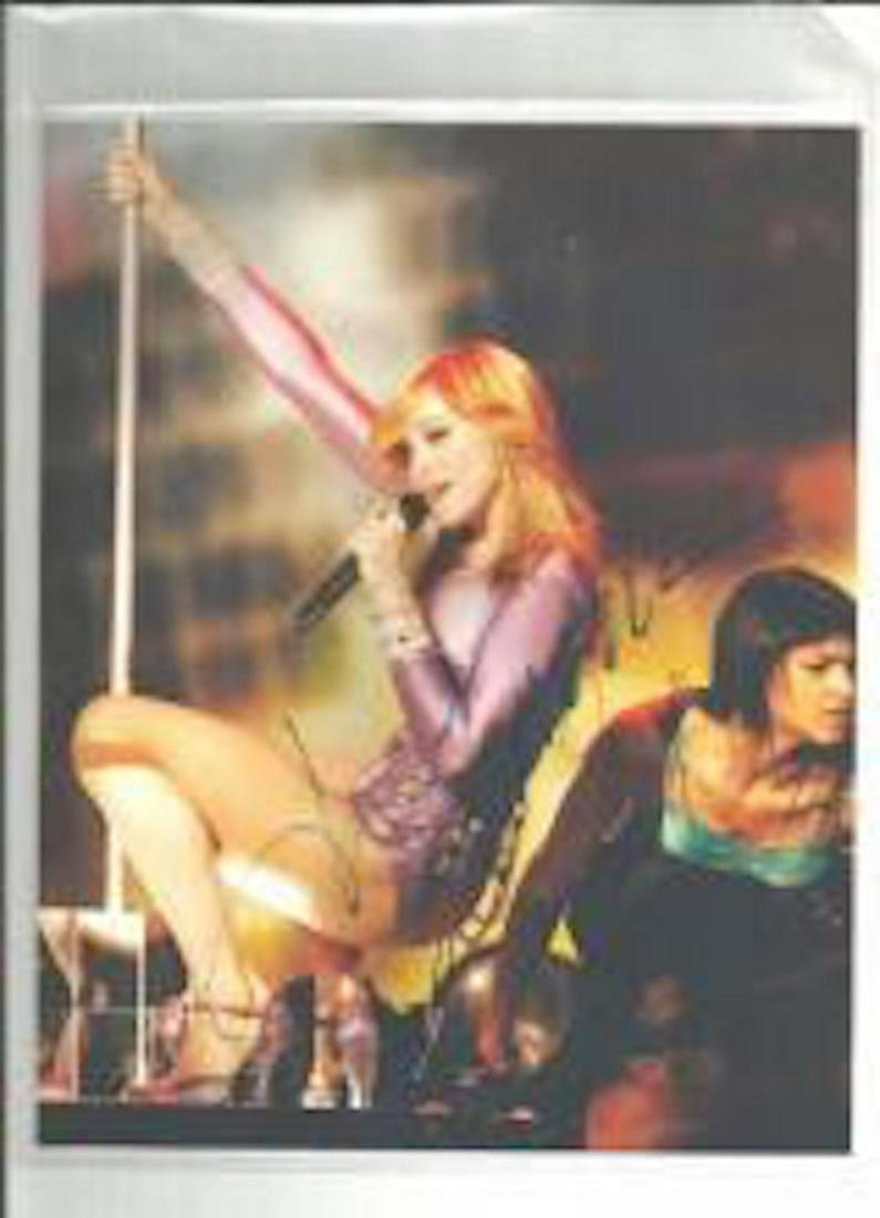 MADONNA SIGNED 8 X 10 PHOTOGRAPH: MADONNA SIGNED 8 X 10 PHOTOGRAPH. THIS ITEM HAS BEEN INSPECTED AND AUTHENTICALLY VERIFIED. IT IS NOT A COPY, REPRINT, OR ANY KIND OF FACSIMILE OF THE ARTIST'S AUTOGRAPH. IT WAS SIGNED IN PERSON. (LOT 