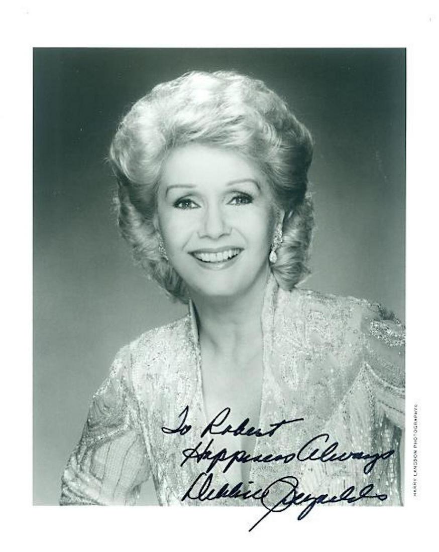 Debbie Reynolds - 8 x 10 Signed Photograph w/COA: Debbie Reynolds - 8 x 10 Signed Photograph w/COA. A signed black and white glossy photograph signed by Debbie Reynolds. Signed in black felt tip ink. Comes with COA