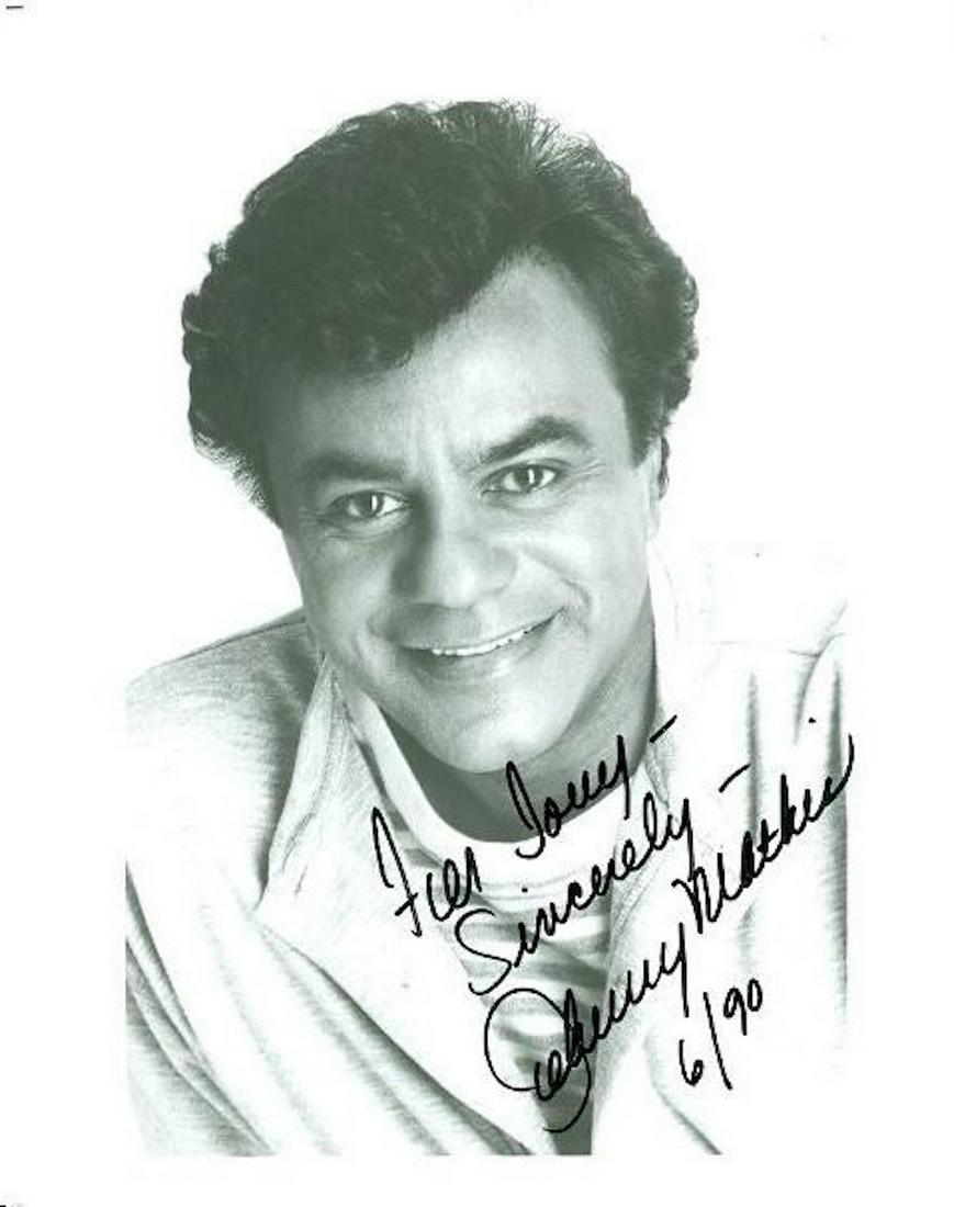 JOHNNY MATHIS SIGNED 8 X 10 PHOTOGRAPH W/COA: JOHNNY MATHIS SIGNED 8 X 10 PHOTOGRAPH W/COA. HERE IS AN 8 X 10 BLACK AND WHITE GLOSSY PHOTOGRAPH INSCRIBED AND SIGNED BY JOHNNY MATHIS. SIGNED IN BLACK FELT TIP INK. IN EXCELLENT CONDITION. THE AUTHE