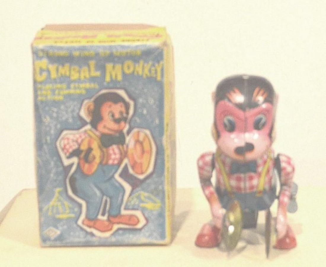 WIND UP CYMBAL MONKEY PLAYING: WIND UP CYMBAL MONKEY PLAYING. COMPLETE AND INTACT. MEASURES AT 6". MINT IN BOX