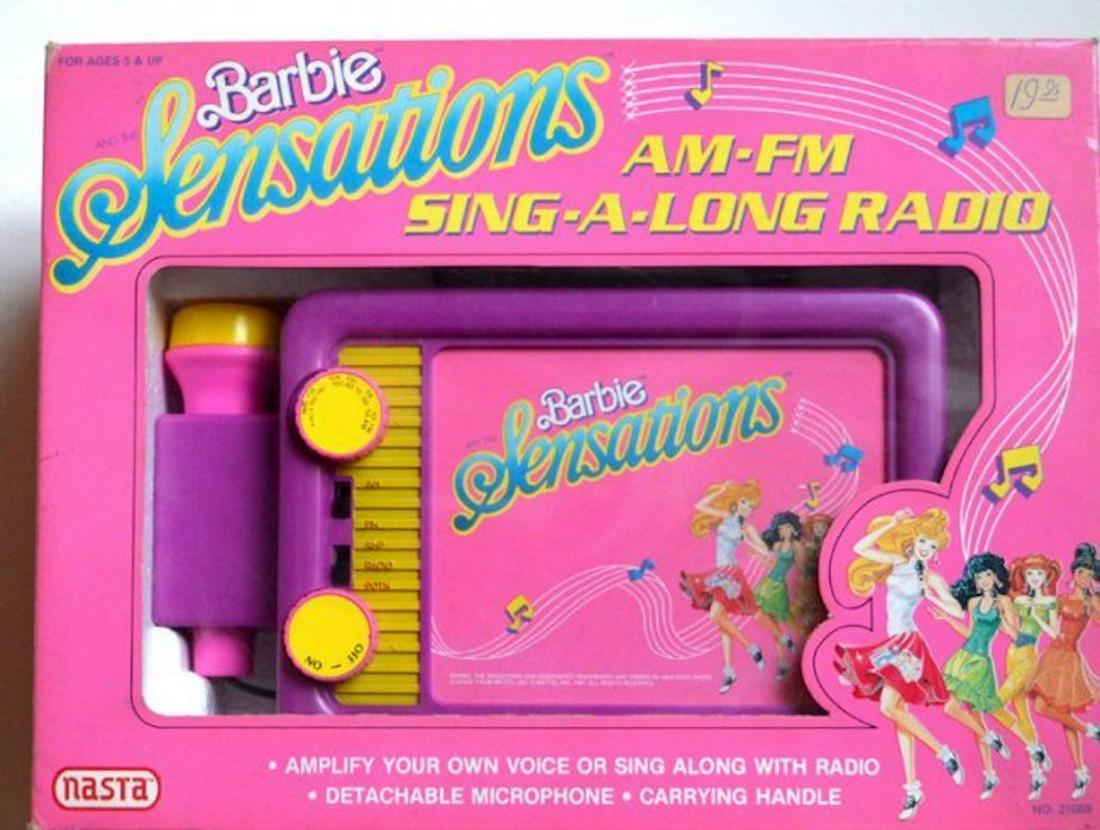 BARBIE SENSATIONS "AM-FM SING-A-LONG RADIO". NO 21069: BARBIE SENSATIONS "AM-FM SING-A-LONG RADIO". NO 21069 AMPLIFY YOUR OWN VOICE OR SING ALONG WITH RADIO. COMES WITH DETACHABLE MICROPHONE AND CARRYING HANDLE. COMPLETE AND INTACT. MINT IN BOX