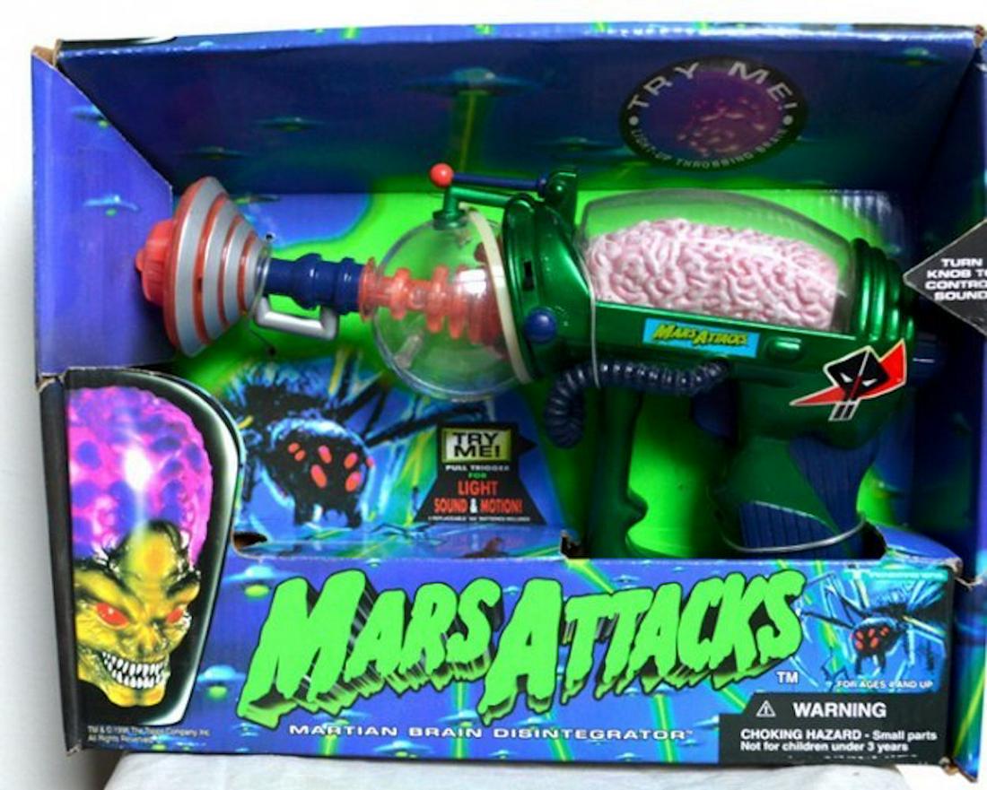 MARS ATTACKS MARTIAN BRAIN (PINK) DISINTEGRATOR GUN: MARS ATTACKS MARTIAN BRAIN DISINTEGRATOR GUN. FEATURES: THROBBING ALIEN BRAIN!, BLAZING LIGHTS!, HORRID SOUNDS!, AND YOU CONTROL IT!MINT IN BOX. COMPLETE AND INTACT