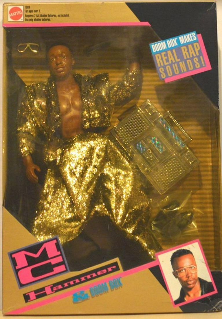 BATTERY OPERATED MC HAMMER BOOM BOX: BATTERY OPERATED MC HAMMER BOOM BOX. BY MATTEL, 1991BOOM BOX MAKES REAL SOUNDS! CONTENTS: BOOM BOX, MC HHAMMER DOLL, SHOES, MC HAMMER SHADES, AND STAGE MICROPHONE.MINT IN BOX. COMPLETE AND INTACT.